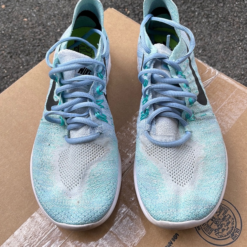 Nike.  Used, but good condition.  Baby blue and super comfy!